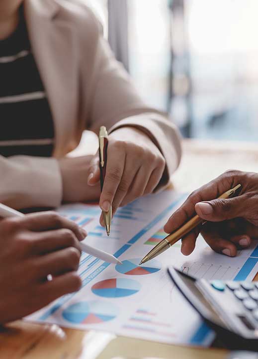 Business professionals working with charts and data